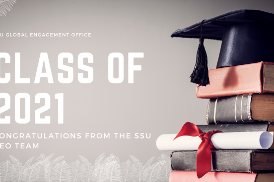 Background image shows a stack of books with a graduation cap and diploma sitting atop; text offers a congratulations to the class of 2021 