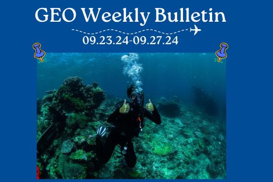 person scuba diving with thumbs up