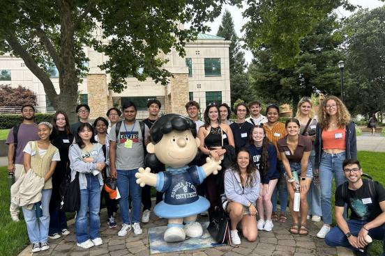 All incoming students posing next to peanut statue