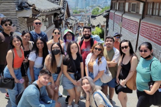 students pose on street in South Korea