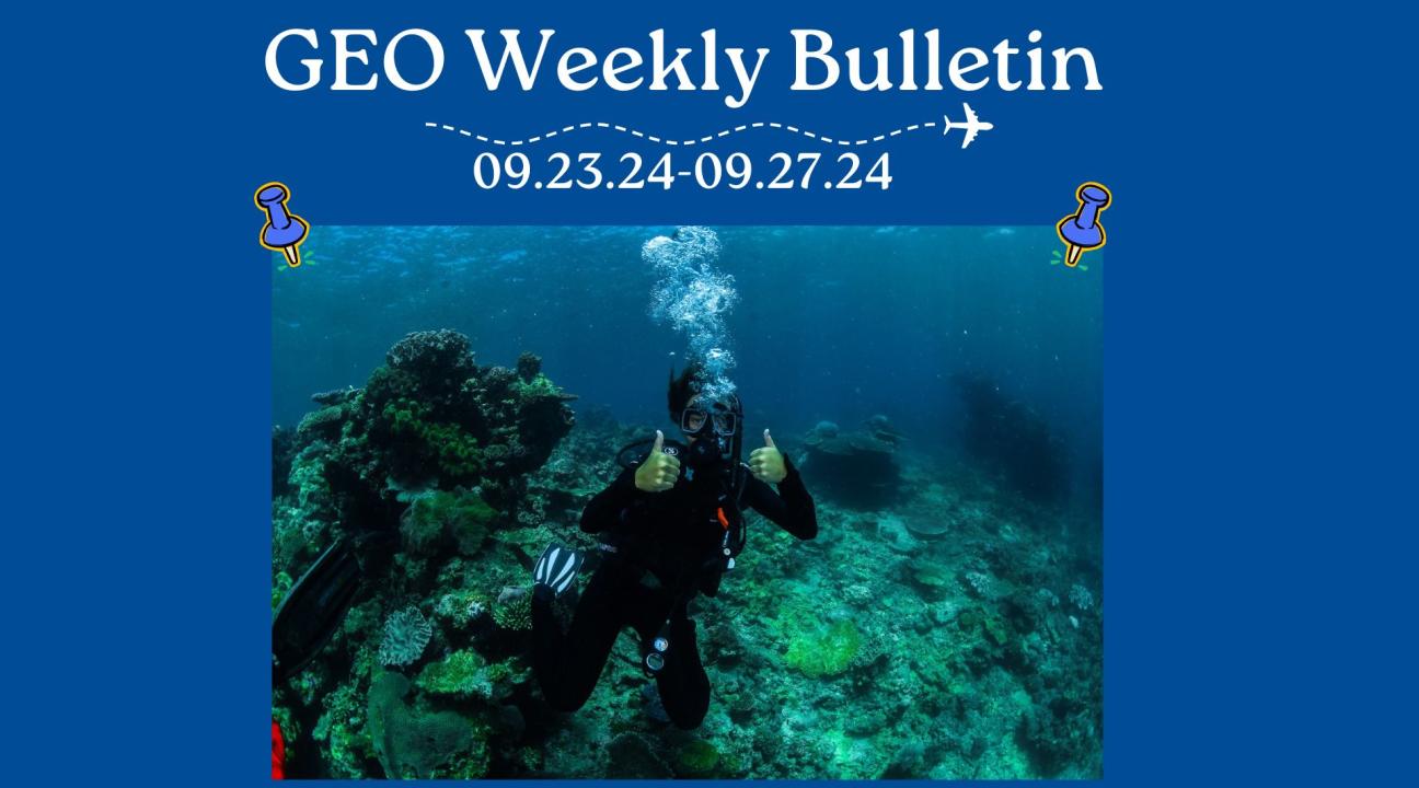 person scuba diving with thumbs up
