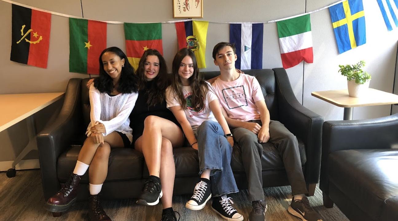 Four ambasadors sitting on couch