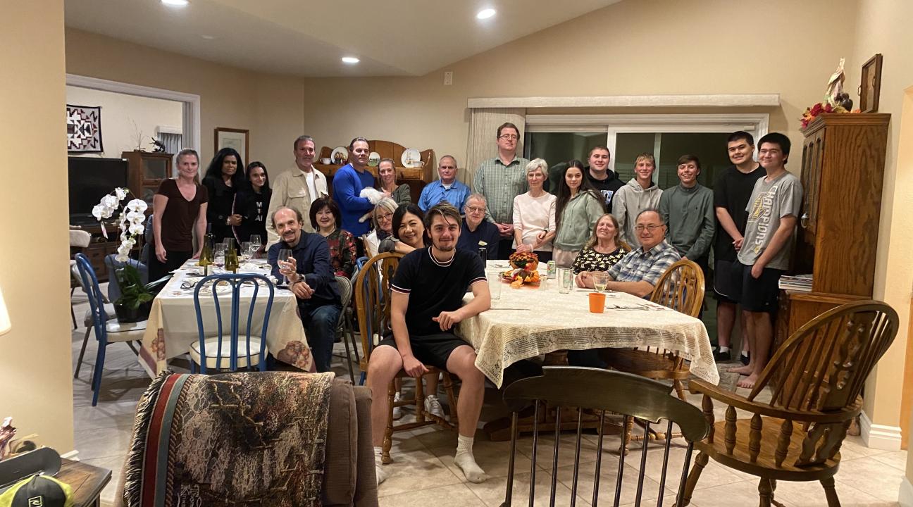 David sits surrounded by American family