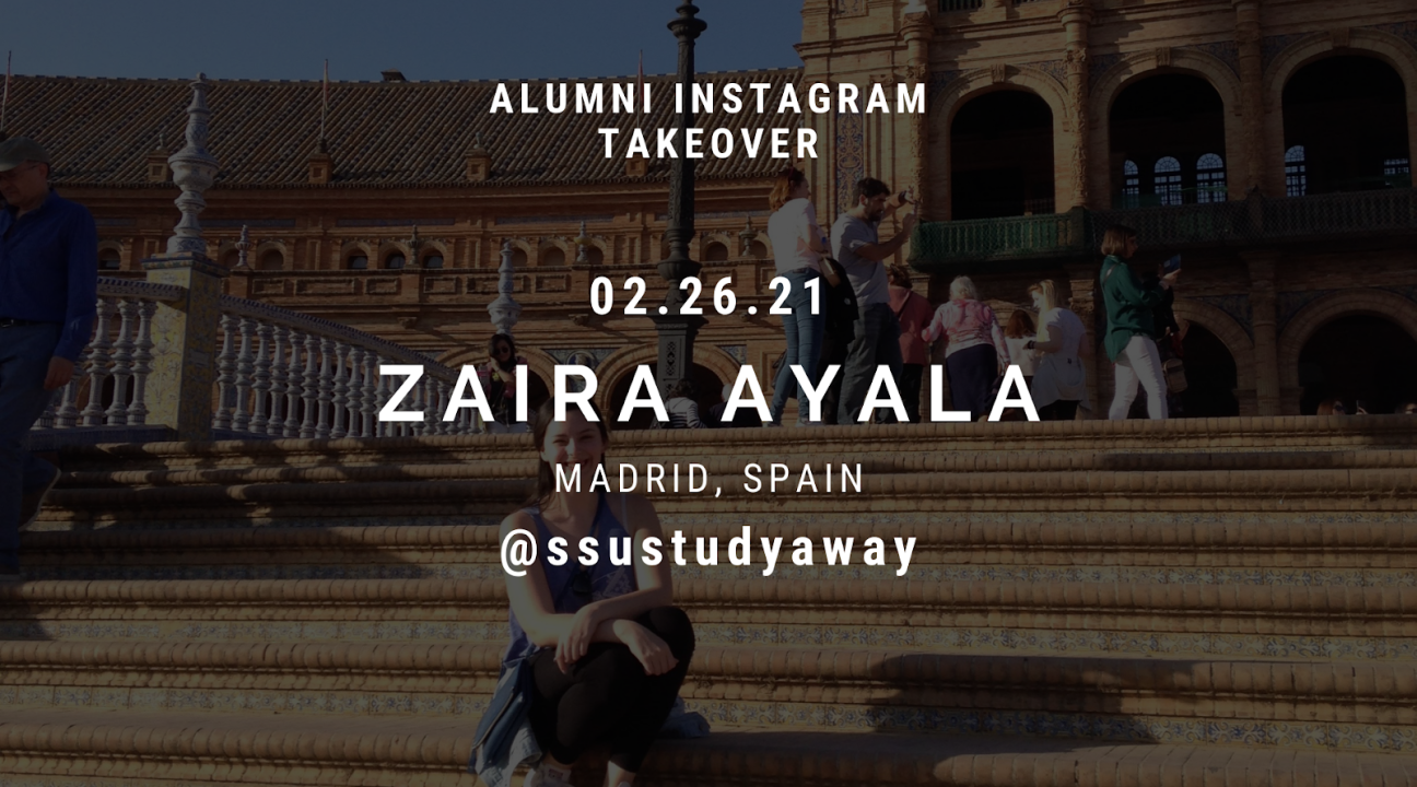 Zaira sitting on the steps of a bridge with other tourists around