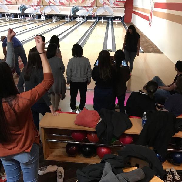 Students bowling.