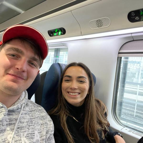Two students on train.