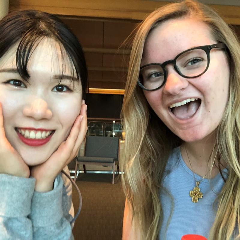 Two ladies taking a smiling selfie