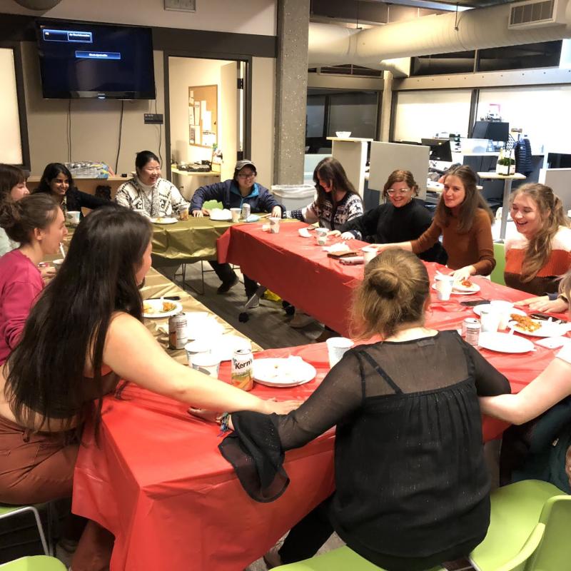 students sitting around thanksgiving table
