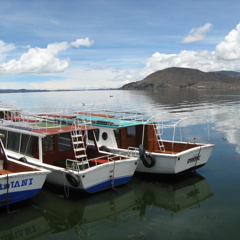 Boats in calm water near a dock