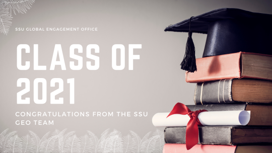 Background image shows a stack of books with a graduation cap and diploma sitting atop; text offers a congratulations to the class of 2021 