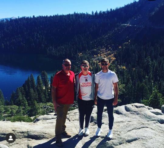 Evan and his family near a lake