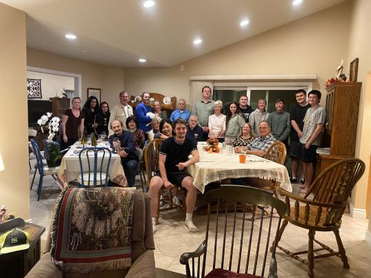 David sits surrounded by American family