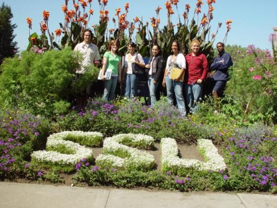 Students standing in a garden